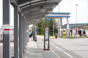 4. Go to the back of the fixed-route bus stop.