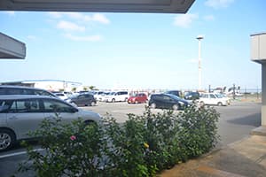 5. [Orix Rent A Car Miyakojima Airport Counter] There is a parking lot next to the building.
